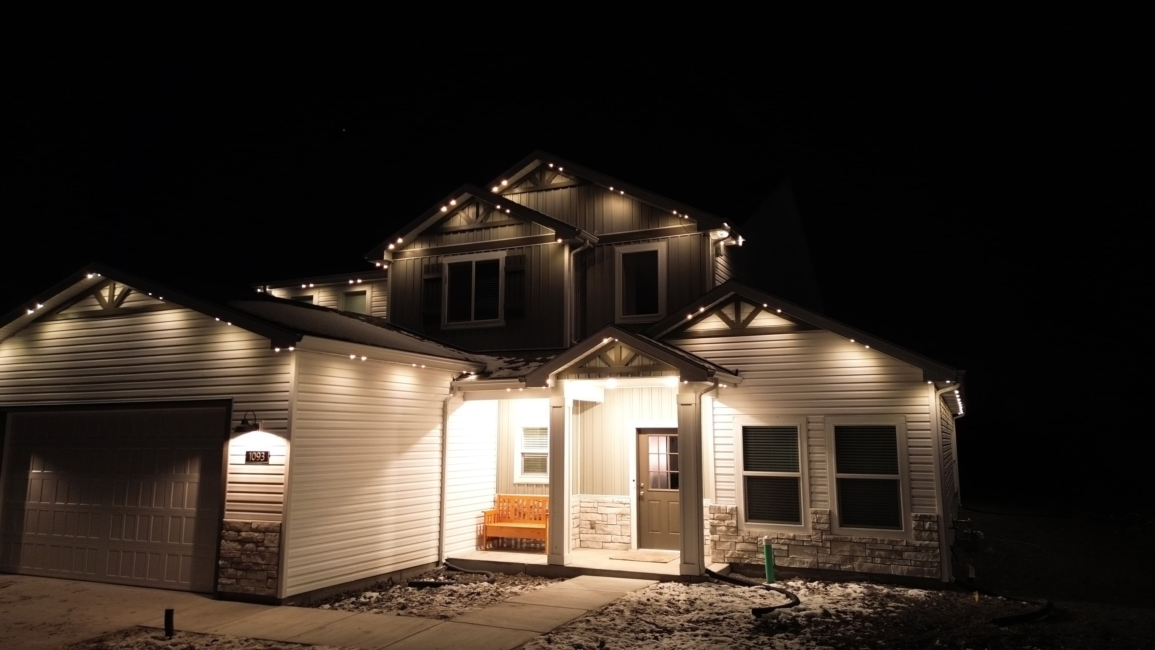 Permanent LED lighting illuminating a deck and patio area